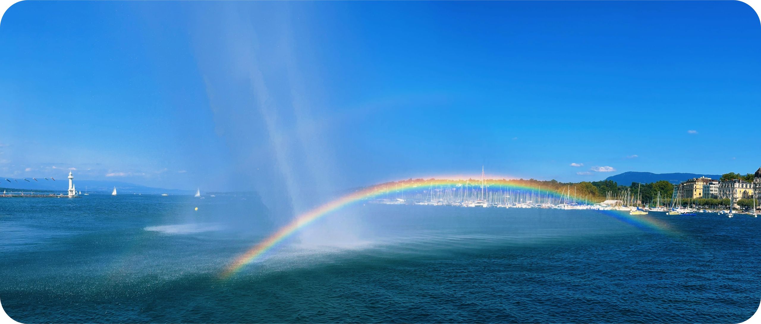 Rainbow under the Jet d'Eau on a sunny day